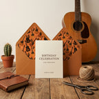 Rustic guitar wrapping paper pattern on birthday envelope liners by Wrapped Studios.
