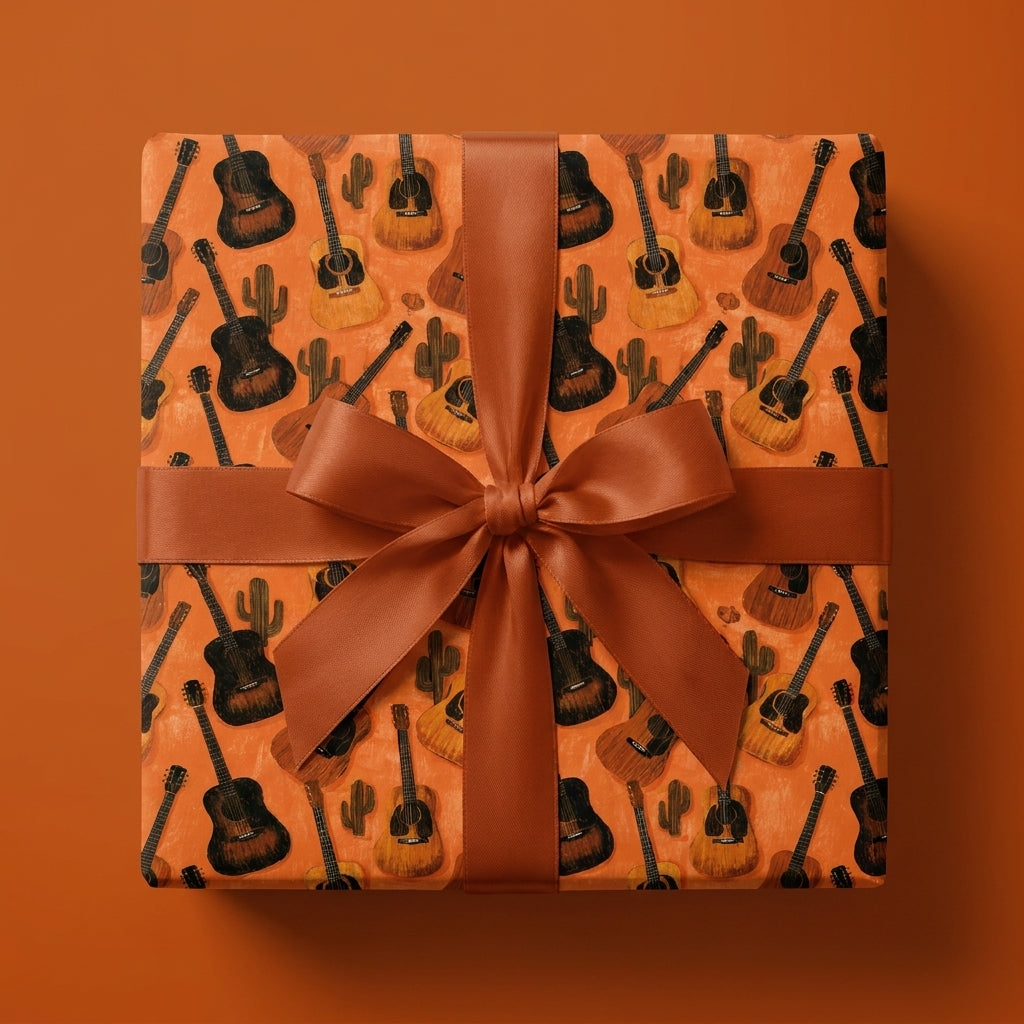 Rustic country guitar wrapping paper with cacti and a terracotta bow, by Wrapped Studios.