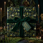 Elegant botanical wrapping paper with velvet ribbon and "Botanical Wishes" tag.