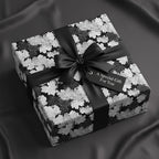 Elegant gift wrapped in black and white floral wrapping paper with a satin ribbon and "A Special Gift For You" tag.
