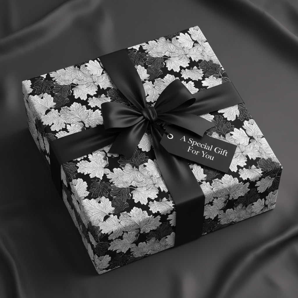 Elegant gift wrapped in black and white floral wrapping paper with a satin ribbon and "A Special Gift For You" tag.