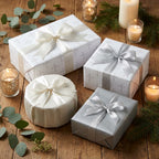 Elegant religious gift wrap with silver crosses and white satin bows for baptism by Wrapped Studios.