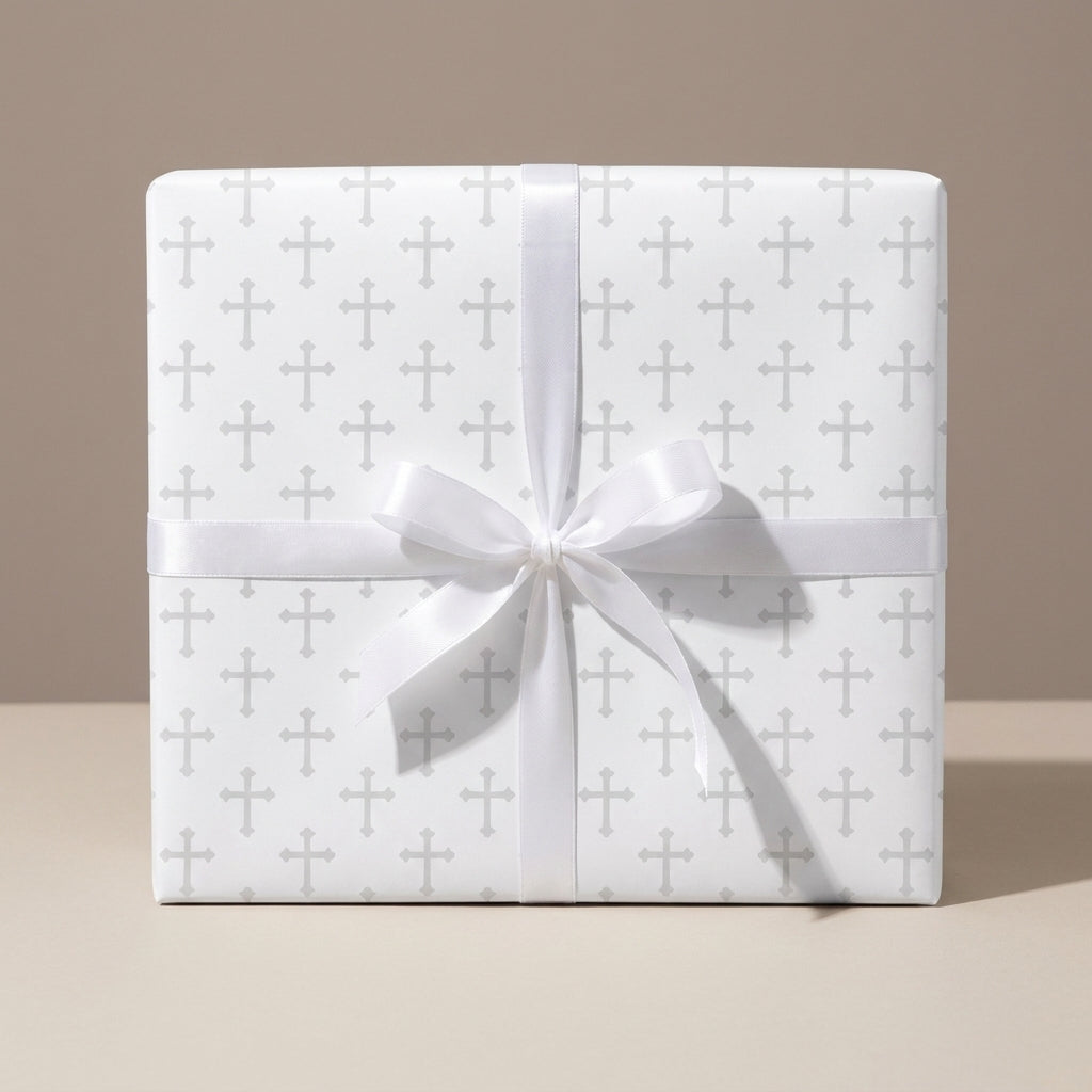 Elegant baptism wrapping paper with a grey cross pattern and white satin bow by Wrapped Studios.