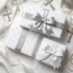 Elegant baptism wrapping paper with silver cross pattern and satin bows by Wrapped Studios.