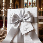 Elegant baptism wrapping paper with silver cross pattern and luxury satin bow by Wrapped Studios.