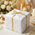 Baptism wrapping paper with silver crosses and elegant gold ribbon by Wrapped Studios.