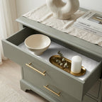 Elegant floral wrapping paper used as a drawer liner in a sage green dresser by Wrapped Studios.