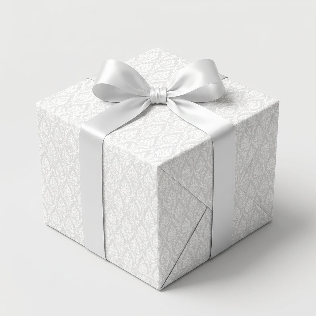 Elegant white damask wedding wrapping paper with a satin bow, luxury gift wrap by Wrapped Studios.