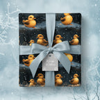Festive baby shower gift wrap with adorable ducks, tied with a silvery-blue satin ribbon and "Warm Wishes" tag.