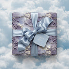 Elegant gift wrapped in luxury floral wrapping paper with a blue satin ribbon and "With Love" tag.