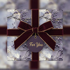 Elegant gift wrapped in floral wrapping paper with a burgundy velvet ribbon and a "For You" tag.