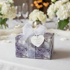 Elegant wedding gift wrap with a lilac floral design, sheer white ribbon, and "Happily Ever After" tag.