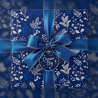 Elegant navy floral wrapping paper with blue satin ribbon, perfect for birthdays or special occasions.
