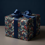 Luxury Christmas wrapping paper with dark floral berry pattern and navy satin bow by Wrapped Studios.