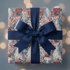 Luxury whimsical jellyfish wrapping paper with a navy blue bow, Wrapped Studios.