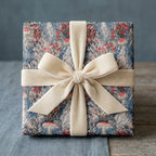 Whimsical luxury gift wrap with jellyfish and mushroom pattern and cream velvet bow by Wrapped Studios.
