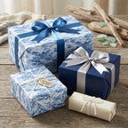 Elegant gifts wrapped in modern blue wrapping paper with satin ribbons for birthday, Christmas, or any celebration.