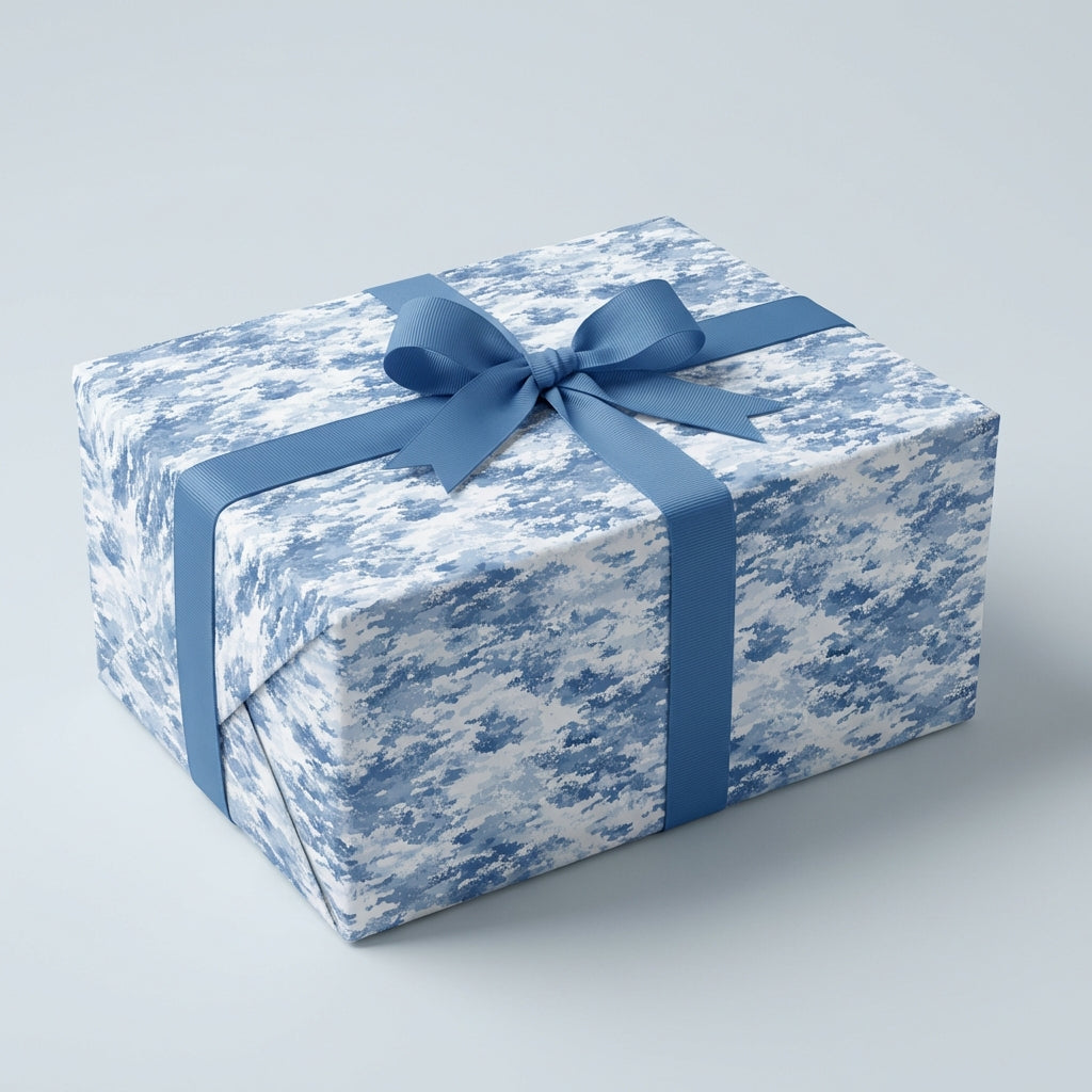 Rectangular gift wrapped in abstract blue wrapping paper with matching ribbon.