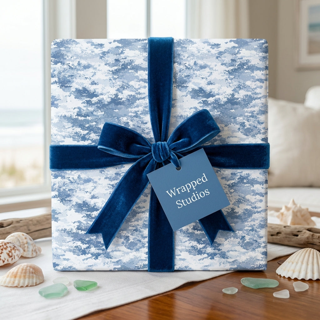 Blue and white cloud pattern wrapping paper with velvet ribbon for ocean-themed gifts.