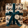 Cavalier King Charles Spaniel dog Christmas wrapping paper with a teal velvet bow by Wrapped Studios.