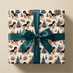 Cavalier King Charles Spaniel Christmas wrapping paper with a teal bow by Wrapped Studios.