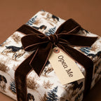 Spaniel dog holiday wrapping paper with brown velvet bow and gift tag by Wrapped Studios.
