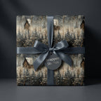 Wrapped Studios rustic Christmas gift wrap with snowy woods scene and gray ribbon.