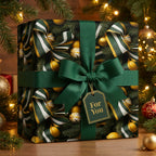 Elegant Christmas gift wrap with emerald ribbon and ornament pattern by Wrapped Studios.