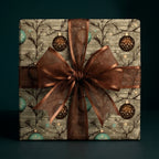 Luxury vintage Christmas wrapping paper with hanging ornaments and a sheer brown ribbon bow, Wrapped Studios.