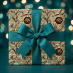 Luxury Christmas wrapping paper with a teal bow and rustic ornament pattern by Wrapped Studios.