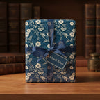 Elegant gift wrapped in navy floral wrapping paper with a sheer ribbon and "A Small Token" tag.