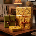 Elegant gifts wrapped in floral wrapping paper with ribbons on a wood table in a cozy, traditional room.