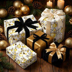 Elegant gold botanical Christmas wrapping paper with black velvet bows by Wrapped Studios.
