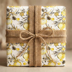 Rustic Christmas wrapping paper with yellow ornaments and burlap ribbon by Wrapped Studios.